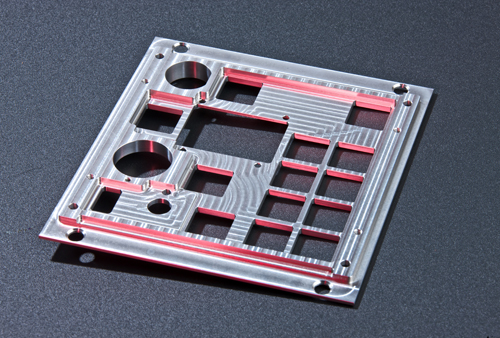 A CNC milling switch mounting plate - a precision component for the motorsport industry.